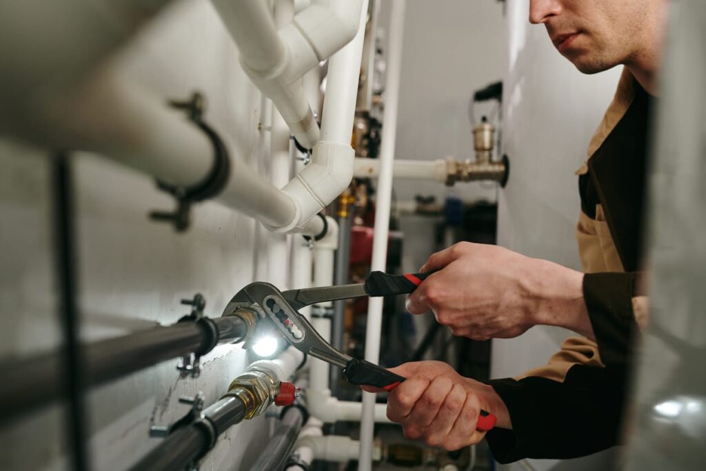 Plumbers maintaining commercial plumbing pipes in Crestview