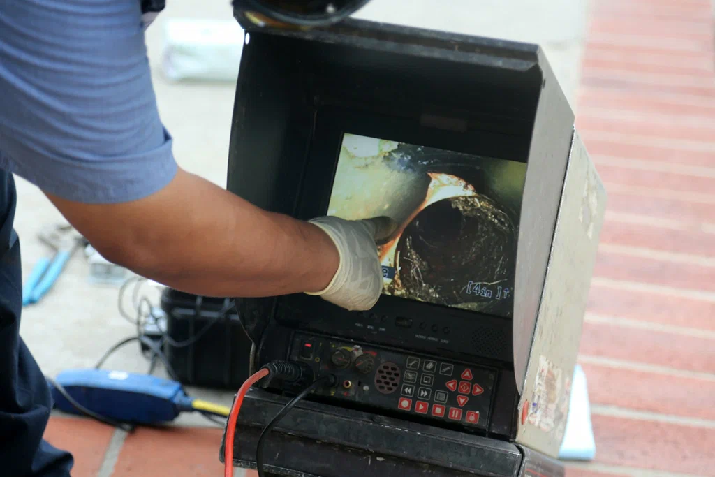 Technician viewing a drain inspection camera in Crestview